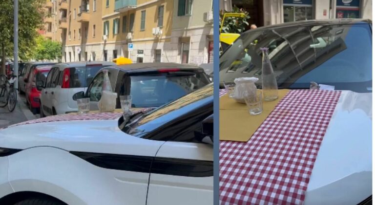 parcheggia suv sul marciapiede del ristorante e trova il cofano apparecchiato con posate e bicchieri